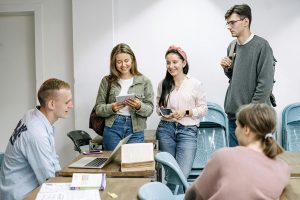 group of students gathered closely in a classroom