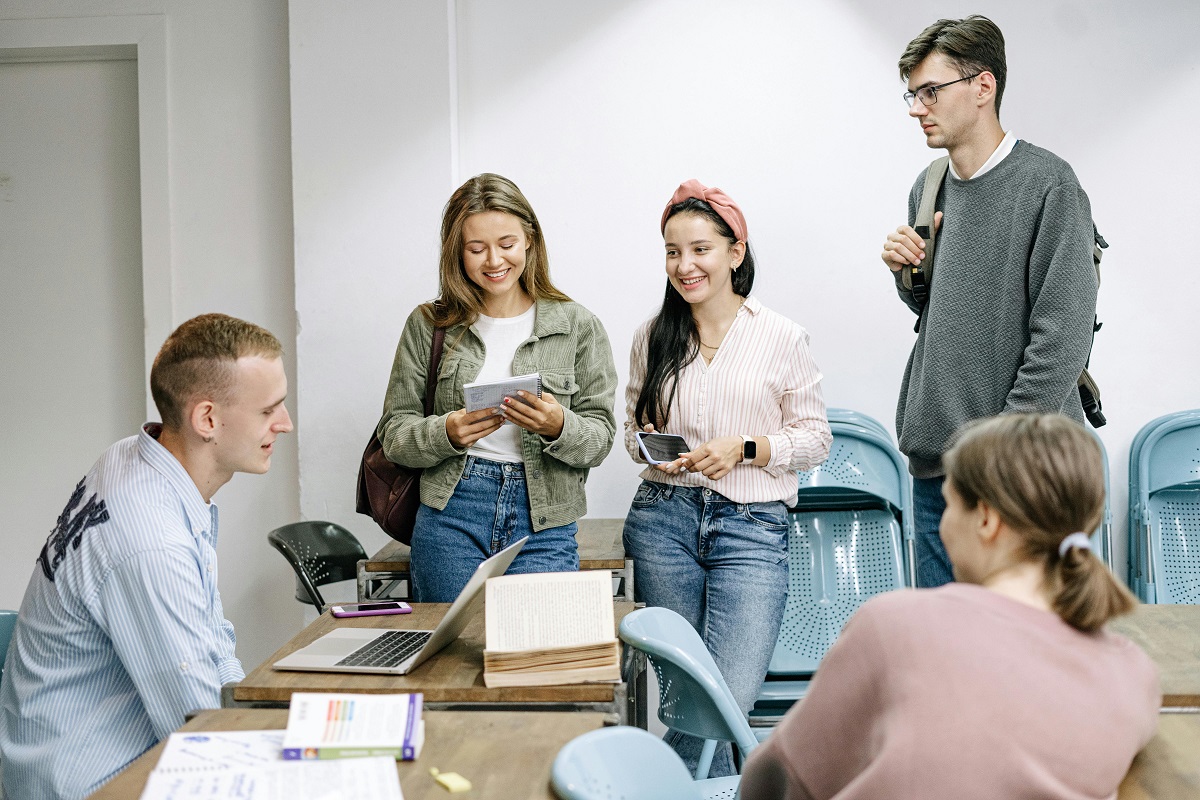 group of students gathered closely in a classroom