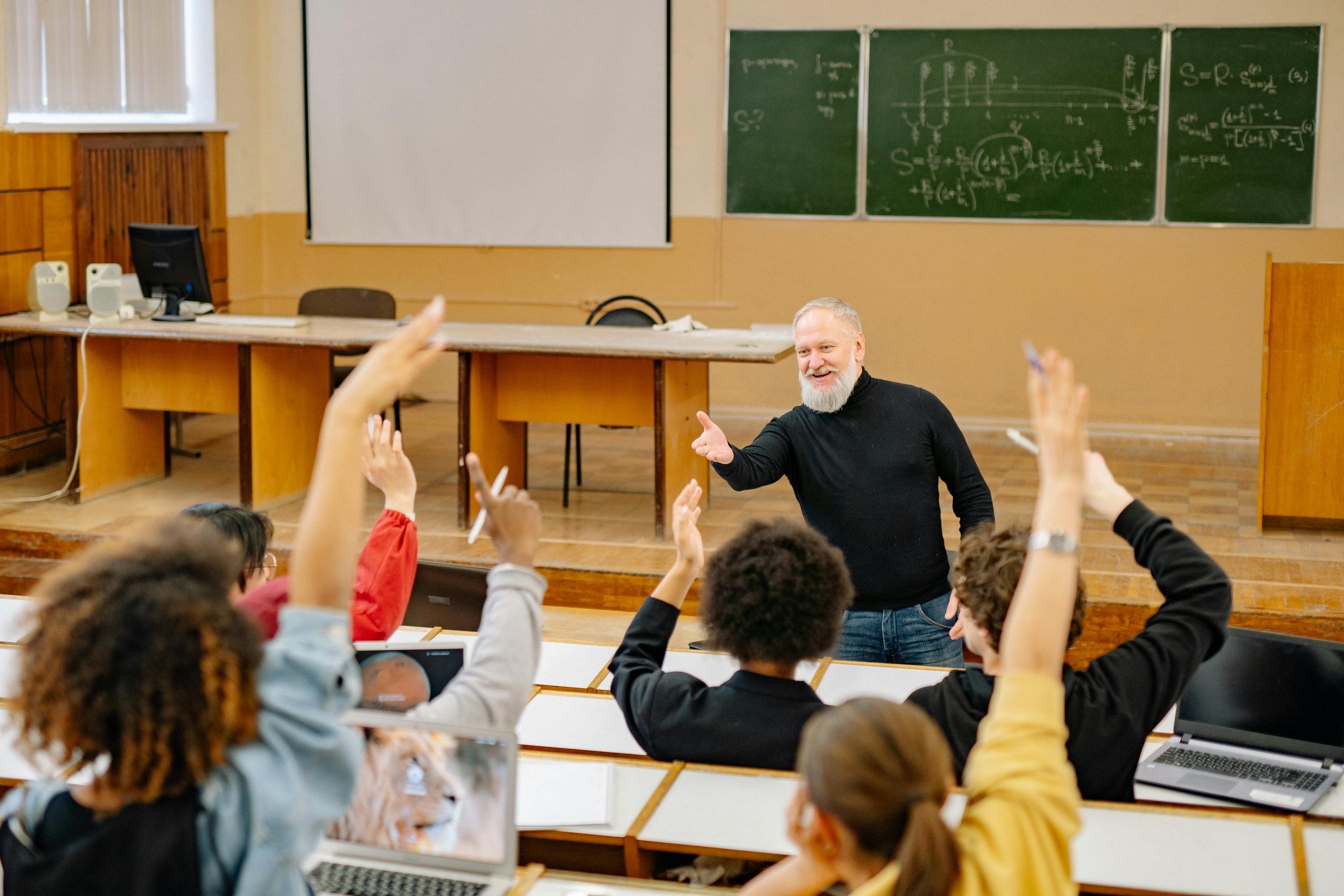 energetic professor teaching a group of college students